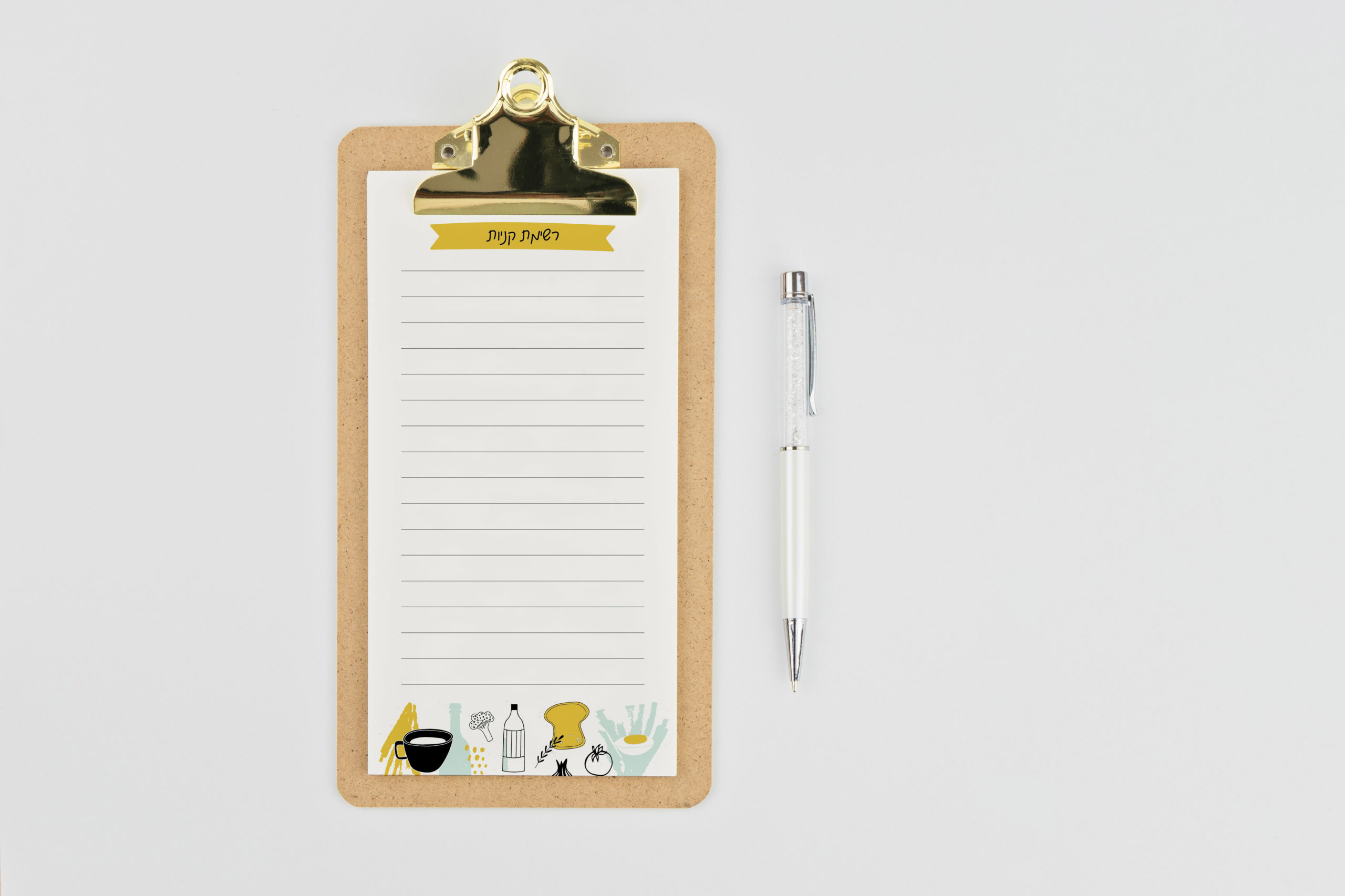 Yearly calendar 2020 clipboard notebook and pen on white background, copy space, flat lay style. New beginnings planning concept